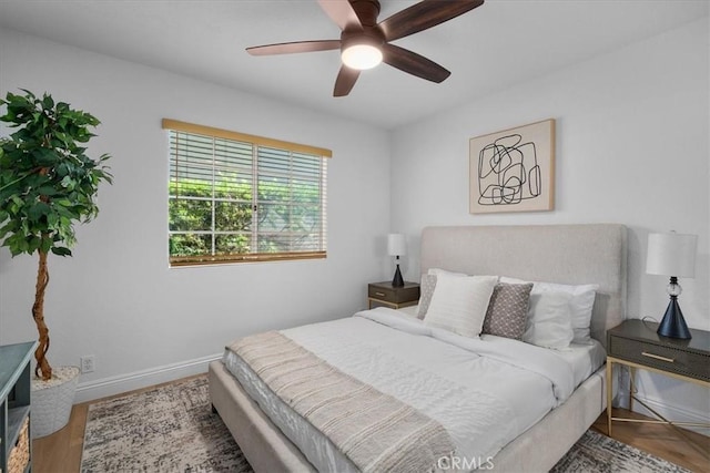 bedroom featuring hardwood / wood-style flooring and ceiling fan