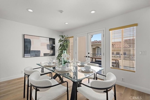 dining room featuring light hardwood / wood-style floors and french doors