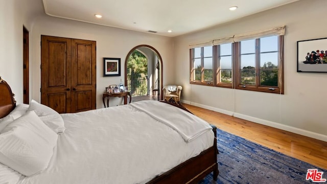 bedroom with hardwood / wood-style floors