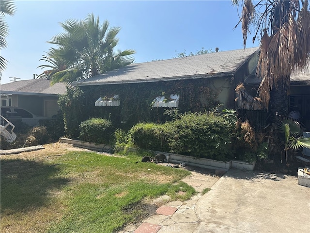 view of home's exterior with a yard