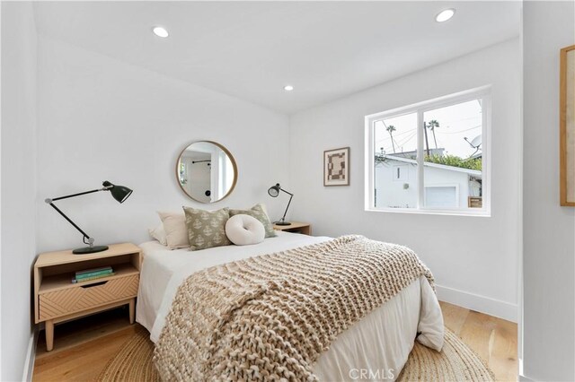 bedroom with wood-type flooring