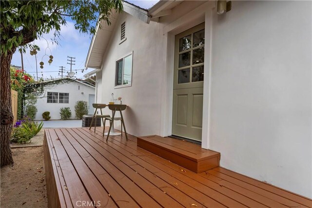 wooden terrace with central AC unit