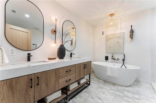 bathroom with a bath and vanity