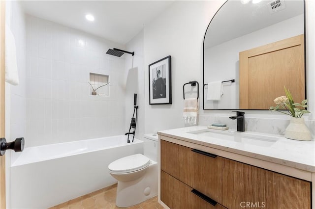 full bathroom with tile patterned flooring, vanity, toilet, and tiled shower / bath