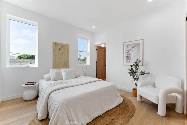 bedroom with light hardwood / wood-style floors