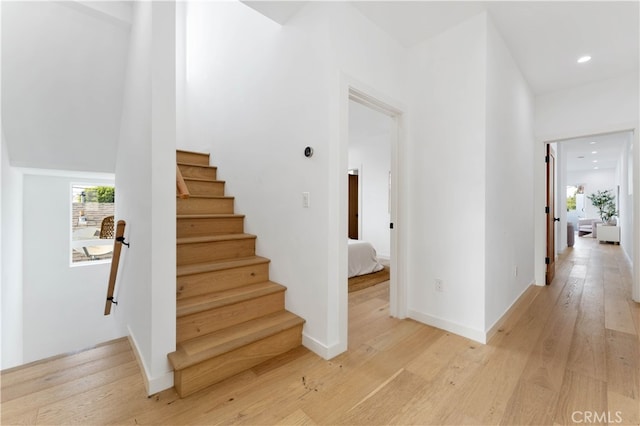 staircase featuring hardwood / wood-style floors