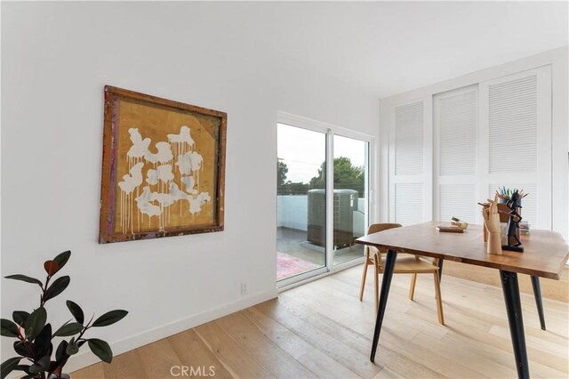 office space with light hardwood / wood-style flooring