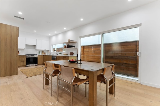 dining area featuring light hardwood / wood-style floors