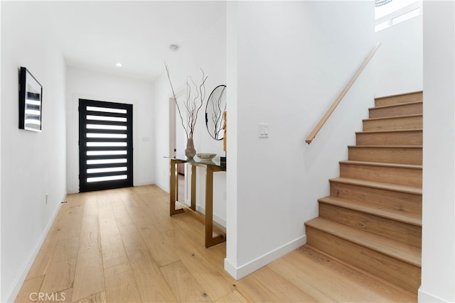 foyer featuring a healthy amount of sunlight and hardwood / wood-style floors