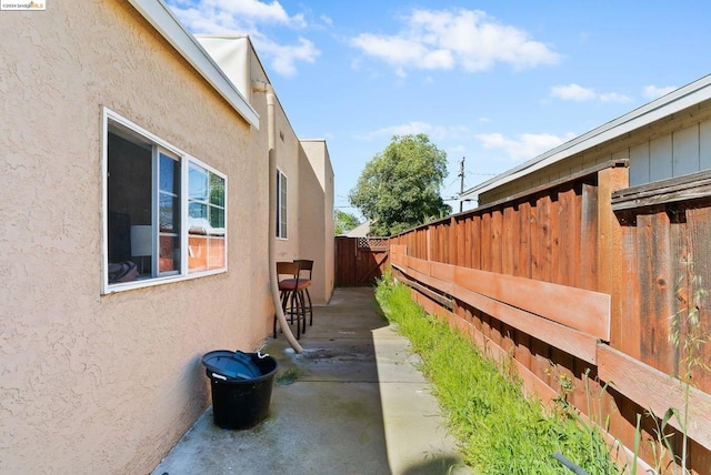 view of side of home featuring a patio area