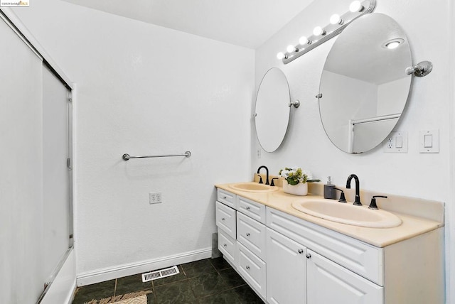 bathroom featuring tile patterned floors and vanity