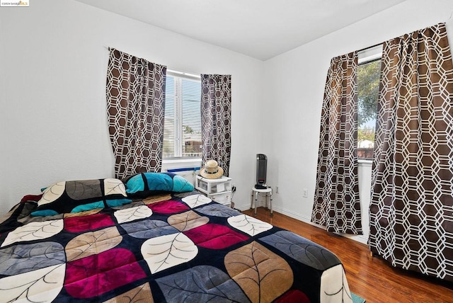 bedroom with wood-type flooring