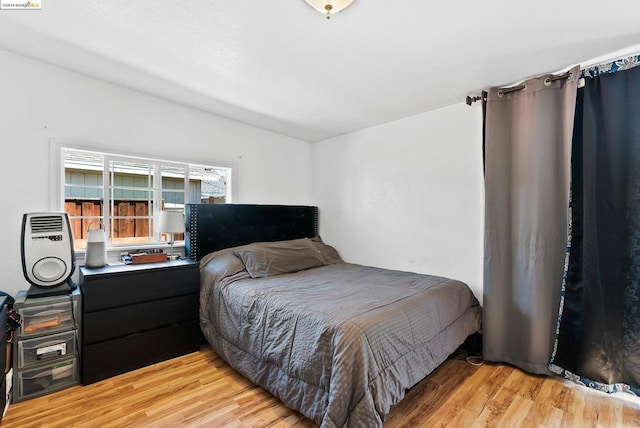 bedroom with light wood-type flooring