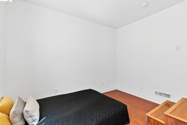 bedroom featuring wood-type flooring