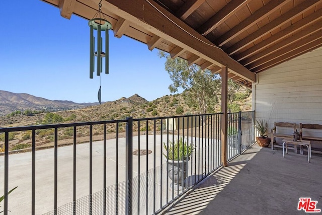 balcony featuring a mountain view