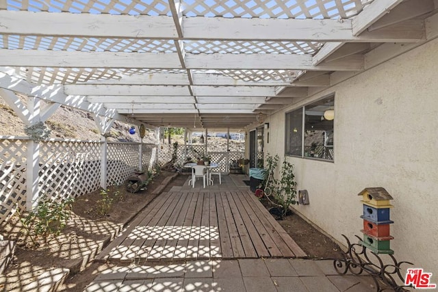 wooden deck with a pergola