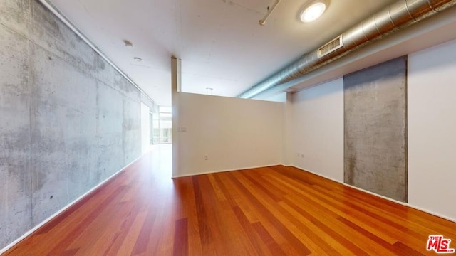 basement featuring hardwood / wood-style floors