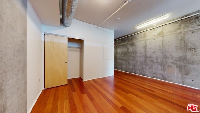 empty room with hardwood / wood-style floors