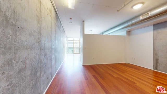 empty room featuring hardwood / wood-style flooring