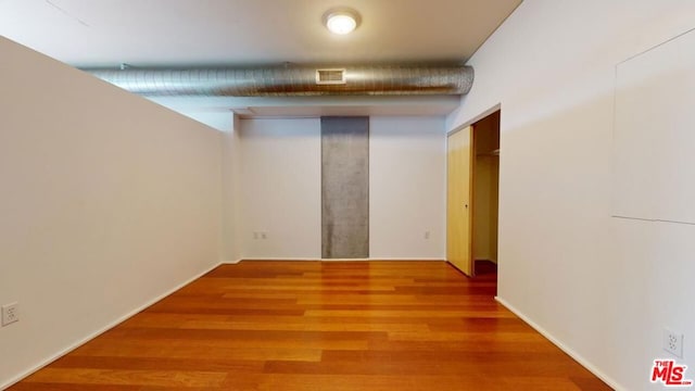 hallway featuring wood-type flooring