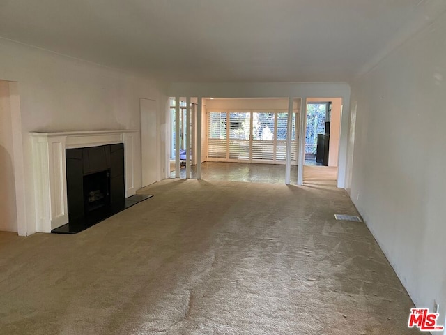 unfurnished living room featuring carpet floors