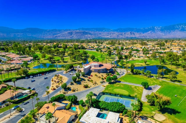 birds eye view of property with a water and mountain view