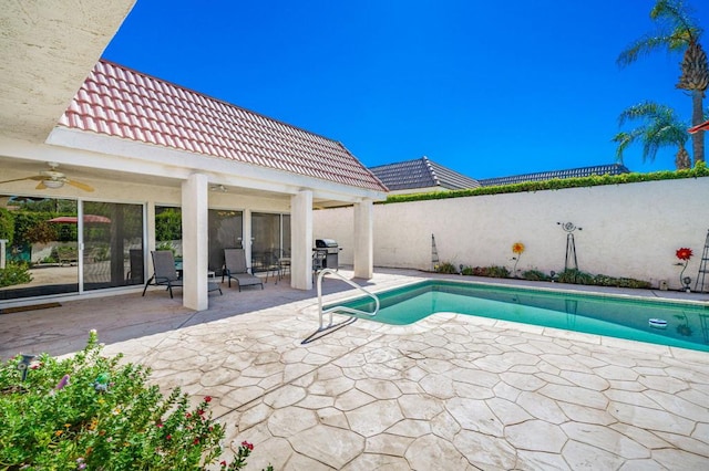 view of pool featuring area for grilling, ceiling fan, and a patio area