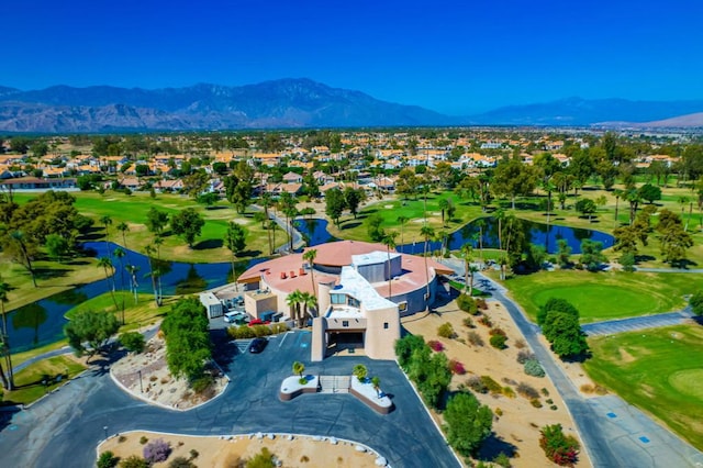 drone / aerial view featuring a water and mountain view