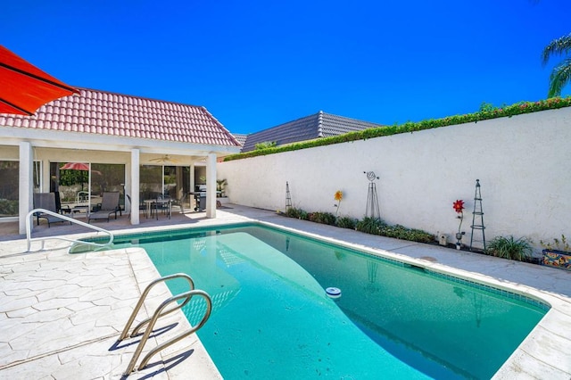 view of pool with a patio and area for grilling