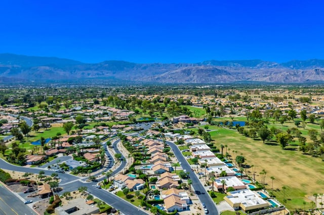 birds eye view of property featuring a mountain view