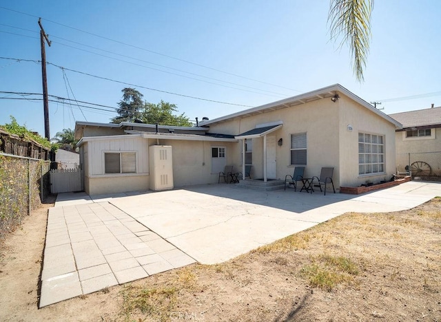 rear view of house with a patio