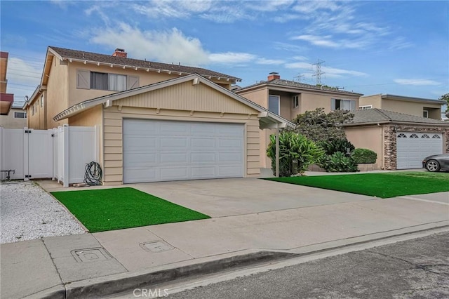 front of property featuring a garage and a front lawn