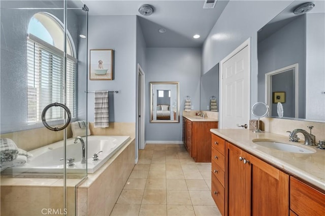 full bathroom with two vanities, tile patterned flooring, a sink, and visible vents