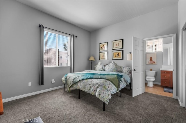 bedroom featuring carpet, baseboards, and connected bathroom