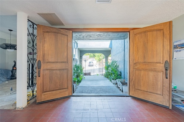 foyer featuring a textured ceiling