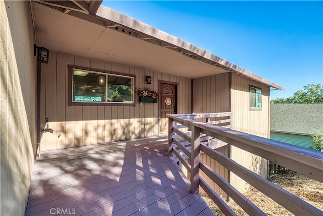 doorway to property featuring a wooden deck