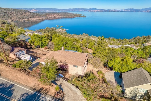 drone / aerial view with a water and mountain view