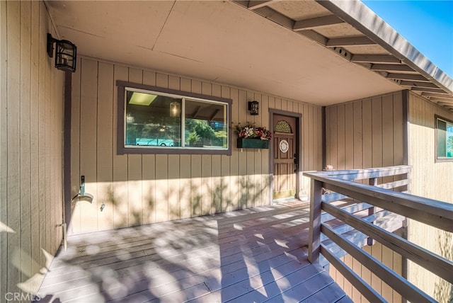 entrance to property with a wooden deck