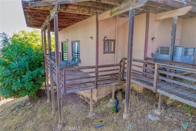 view of property exterior featuring a wooden deck