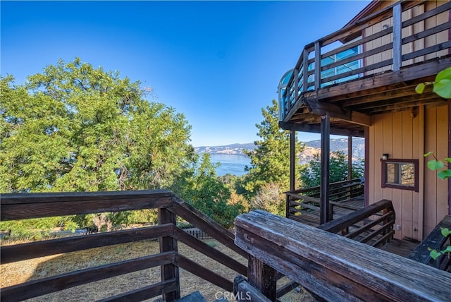 wooden deck with a water view