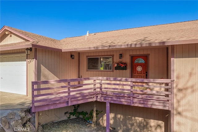 property entrance with a garage