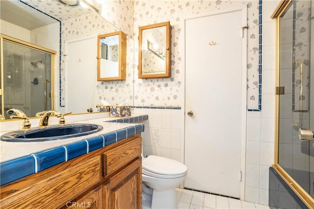 bathroom featuring tile patterned floors, vanity, and toilet