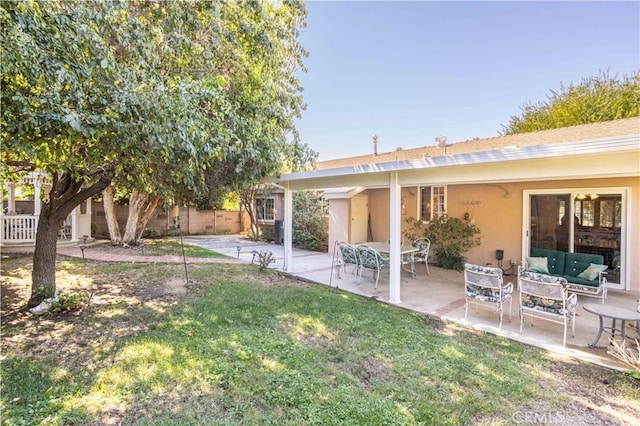 view of yard with outdoor lounge area and a patio