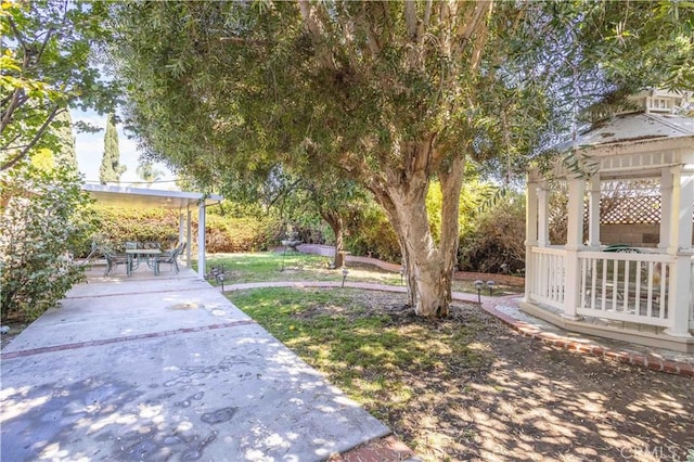 view of yard with a gazebo and a patio