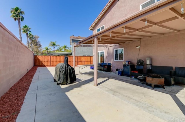 view of patio with an outdoor fire pit