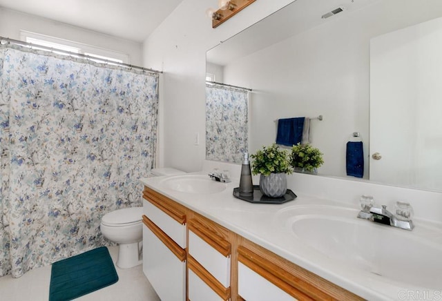 bathroom featuring vanity, curtained shower, and toilet