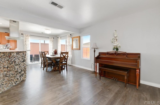 dining room with dark hardwood / wood-style flooring