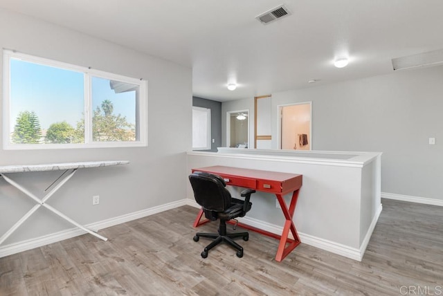 office space with hardwood / wood-style floors