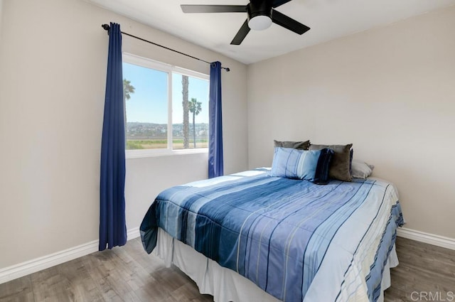 bedroom featuring hardwood / wood-style flooring and ceiling fan