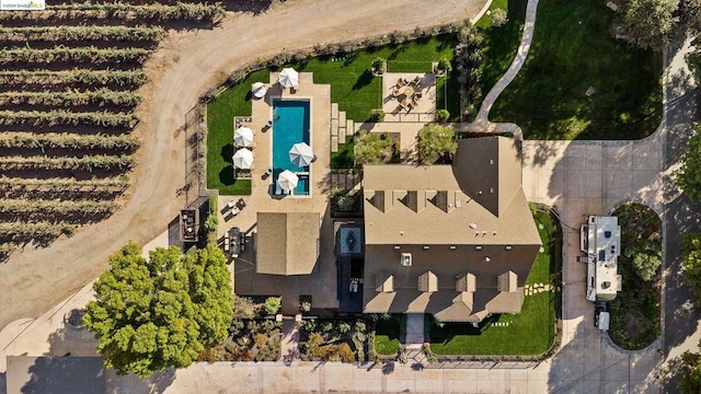 birds eye view of property with a rural view